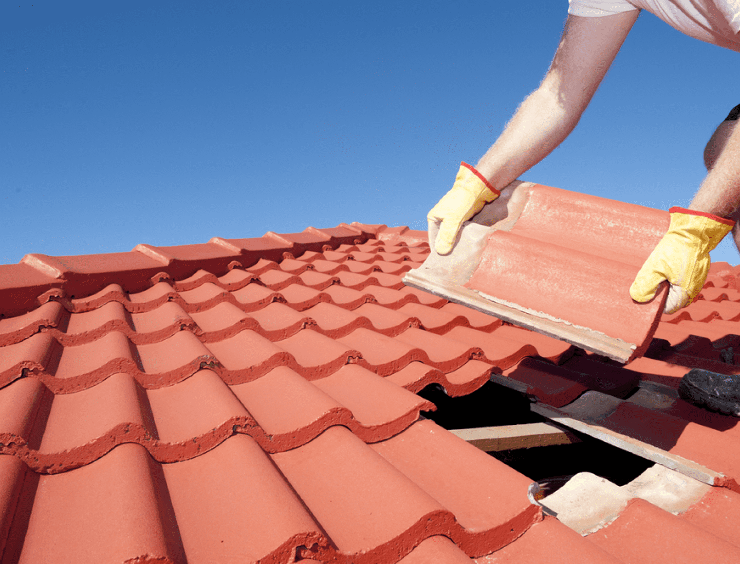 Ridge tiles on a roof with fresh mortar after repointing